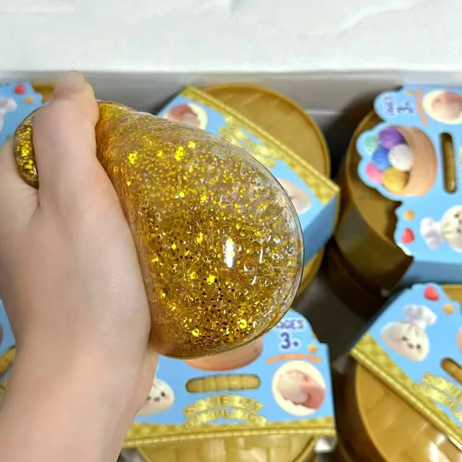 Squeezing a glitter dumpling squishy