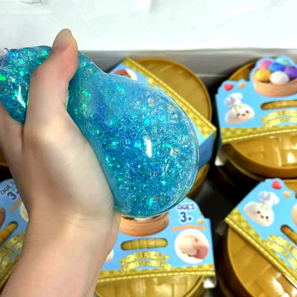 Squeezing a blue glitter dumpling squishy